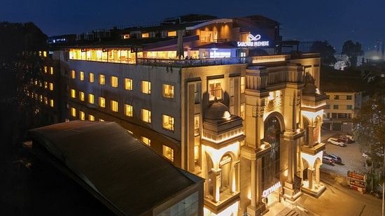 A Stunning night view of the illuminated hotel facade - Sarovar Premiere, Srinagar